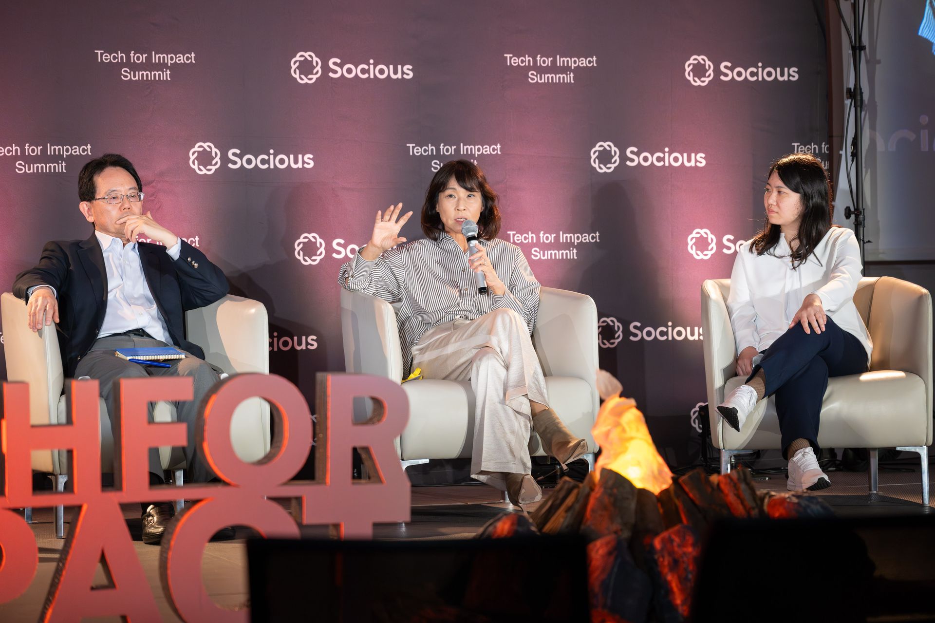 Yumiko Murakami of MPower Partners speaking on the Learning in the Age of AI panel at Tech for Impact Summit 2026, with Satoshi Hirose and Maiko Kojima on stage