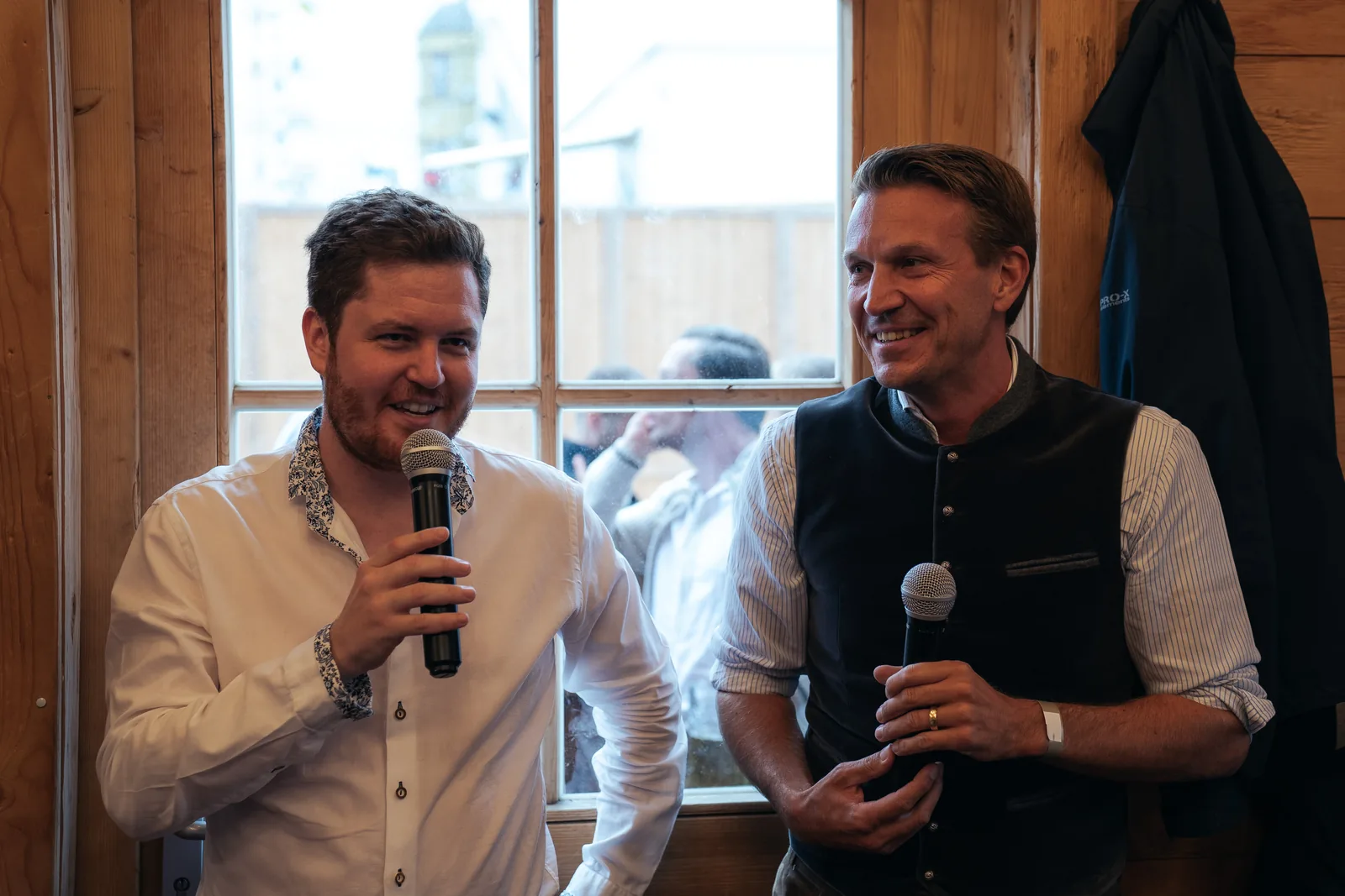 Two speakers sharing a fireside conversation with microphones at Tech for Climate 2026