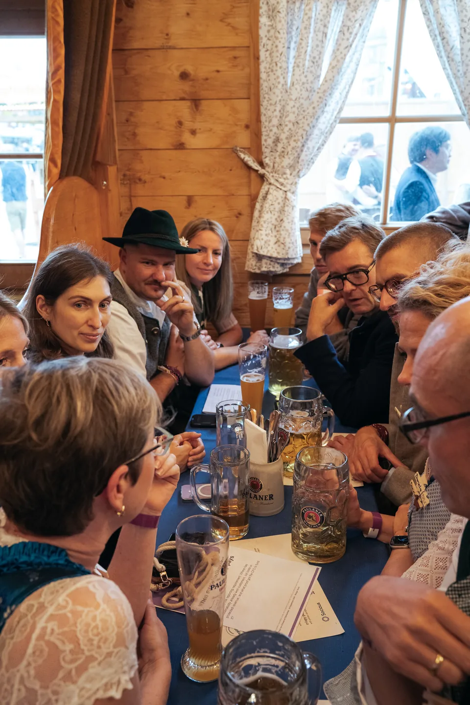 Guests listening around a blue-covered table at Tech for Climate 2026