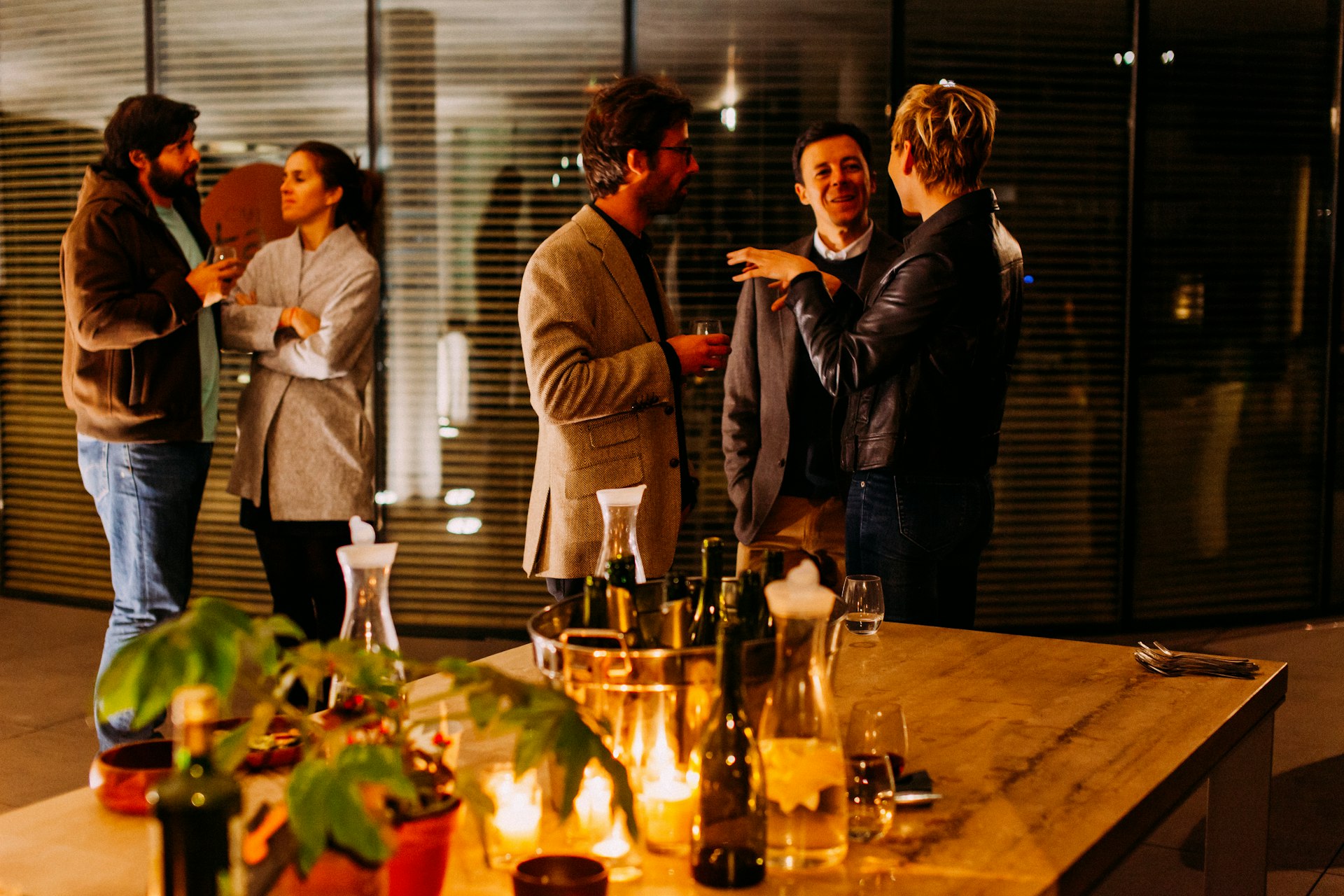 A small group networking and laughing together at a casual daytime meetup.